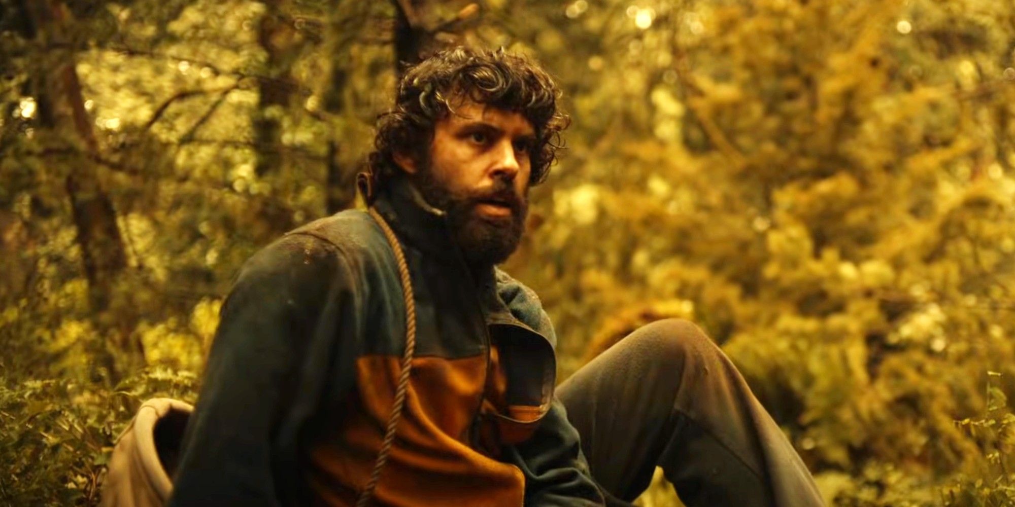 Coach Ben sitting in the wilderness in Yellowjackets season 3