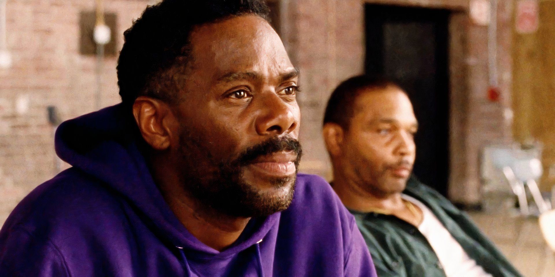 Colman Domingo leaning forward in his seat while Clarence Maclin lounges in the background in Sing Sing
