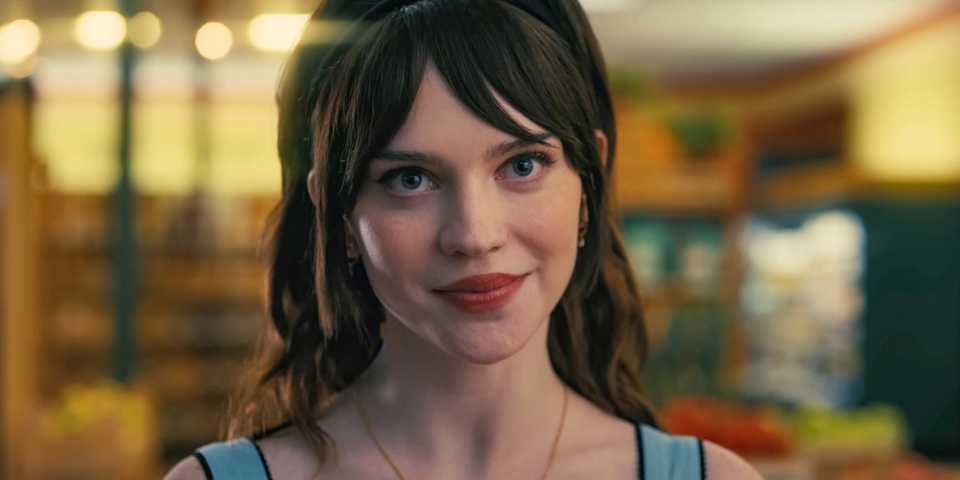 Sophie Thatcher smiling as Iris in Companion