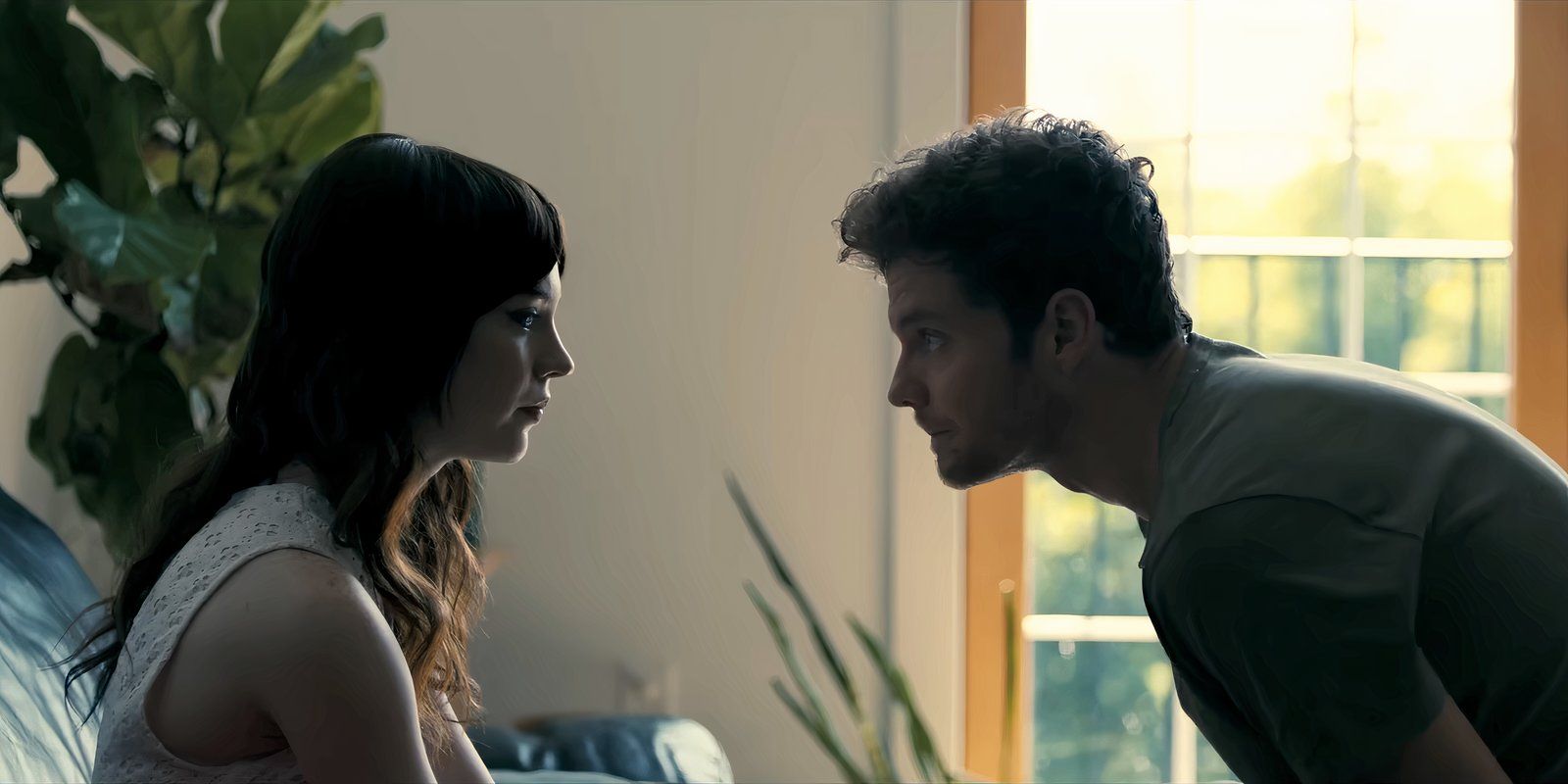 Sophie Thatcher and Jack Quaid staring at each other in Companion