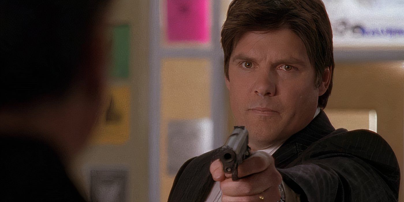 Dan Scott pointing gun at Keith in One Tree Hill