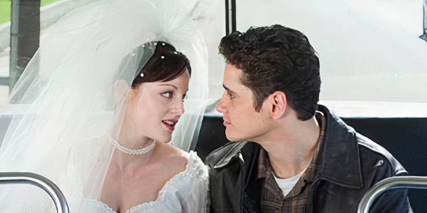 Dana Daurey As Heather Tupperman in a wedding dress sitting in the back of a bus with Robert in Providence-1