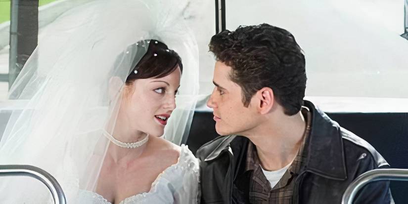 Dana Daurey As Heather Tupperman in a wedding dress sitting in the back of a bus with Robert in Providence-1