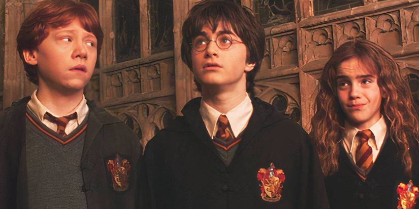 Daniel Radcliffe, Rupert Grint, and Emma Watson as Harry, Ron, and Hermione in Harry Potter and the Chamber of Secrets