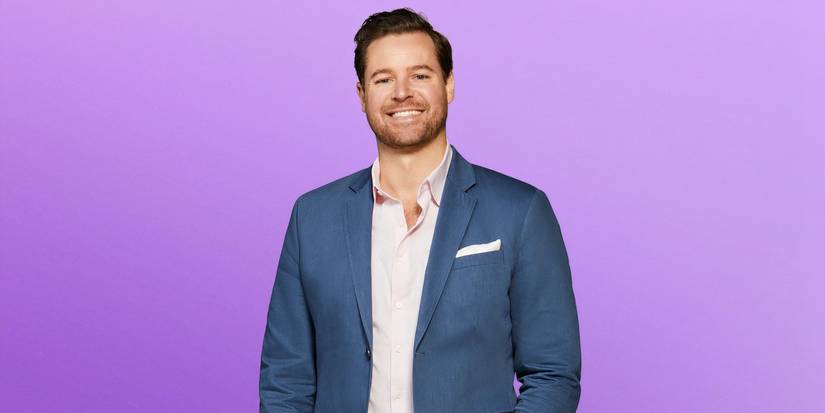 Love is blind season 8 David Bettenburg in a suit smiling during the show's promo shoot.