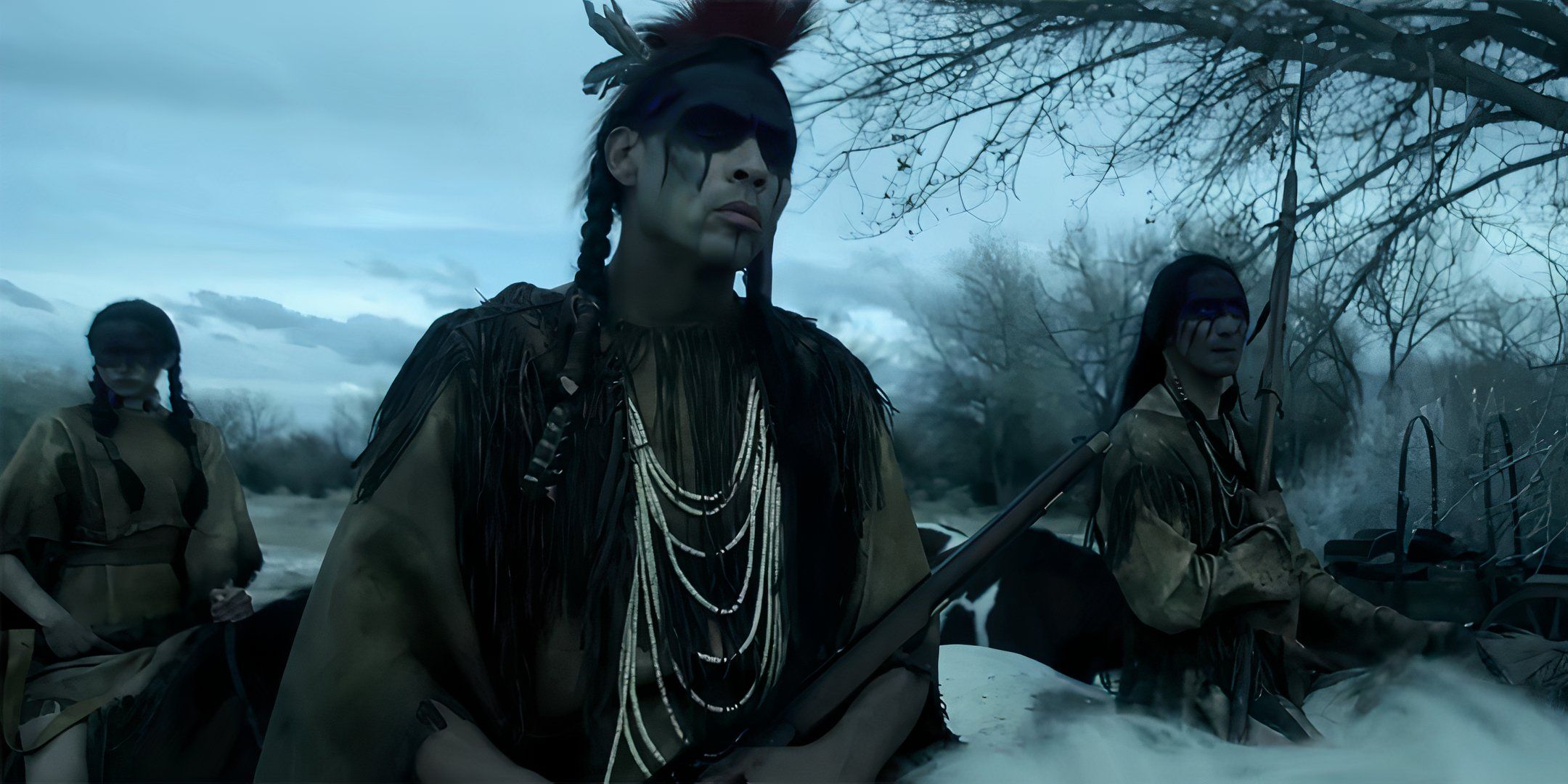 Derek Hinkey's Red Feather looking intensely while holding a rifle in American Primeval