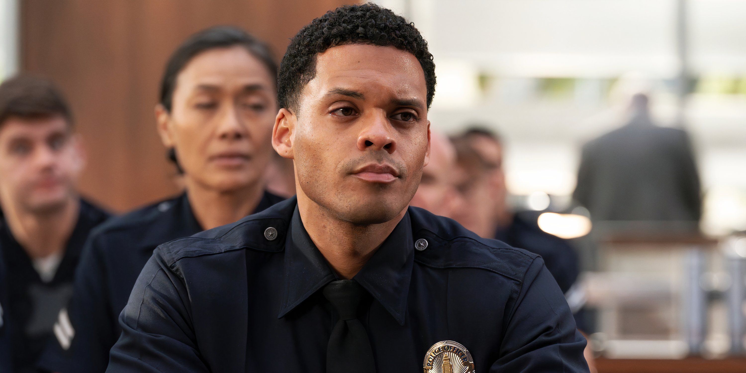 Deric Augustine as Miles in The Rookie season 7, looking thoughtful