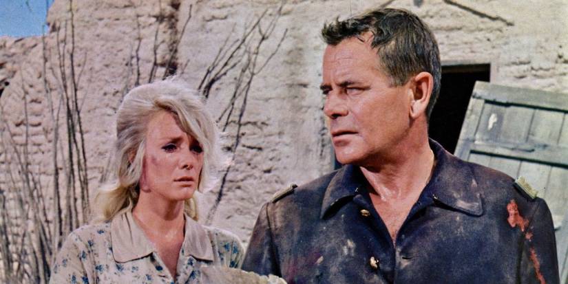 Emily (Inger Stevens) looking distraught with Major Wolcott (Glenn Ford) covered in blood in A Time for Killing.