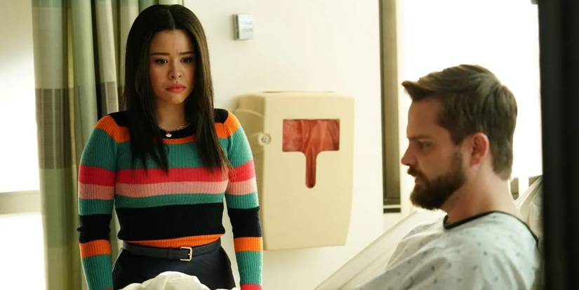 Evan (T.J. Linnard) sitting in a hospital bed as Mariana (Cierra Ramirez) looks worried in Good Trouble.