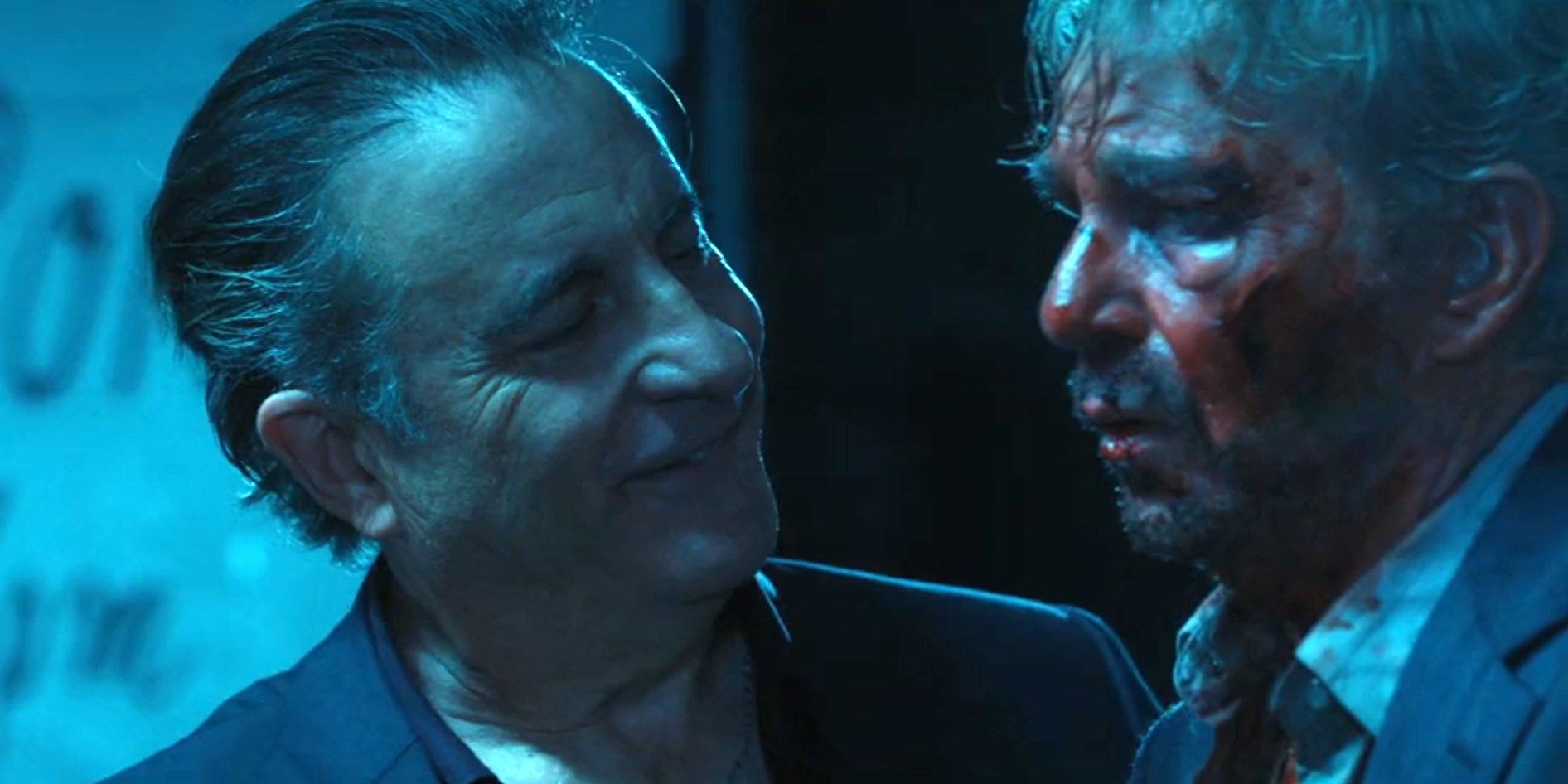 Gallino (Andy Garcia) smiling at a bloody and beaten Tommy Norris (Billy Bob Thornton) in Landman season 1, episode 10