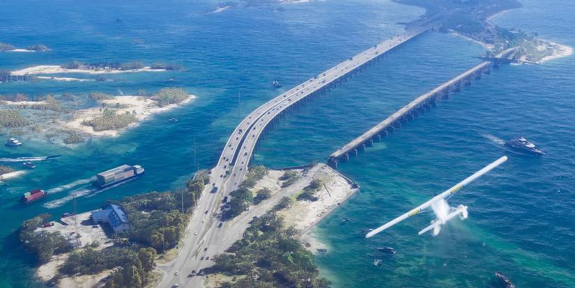 A screenshot from the GTA 6 trailer showing a plane flying over the water near Vice City.