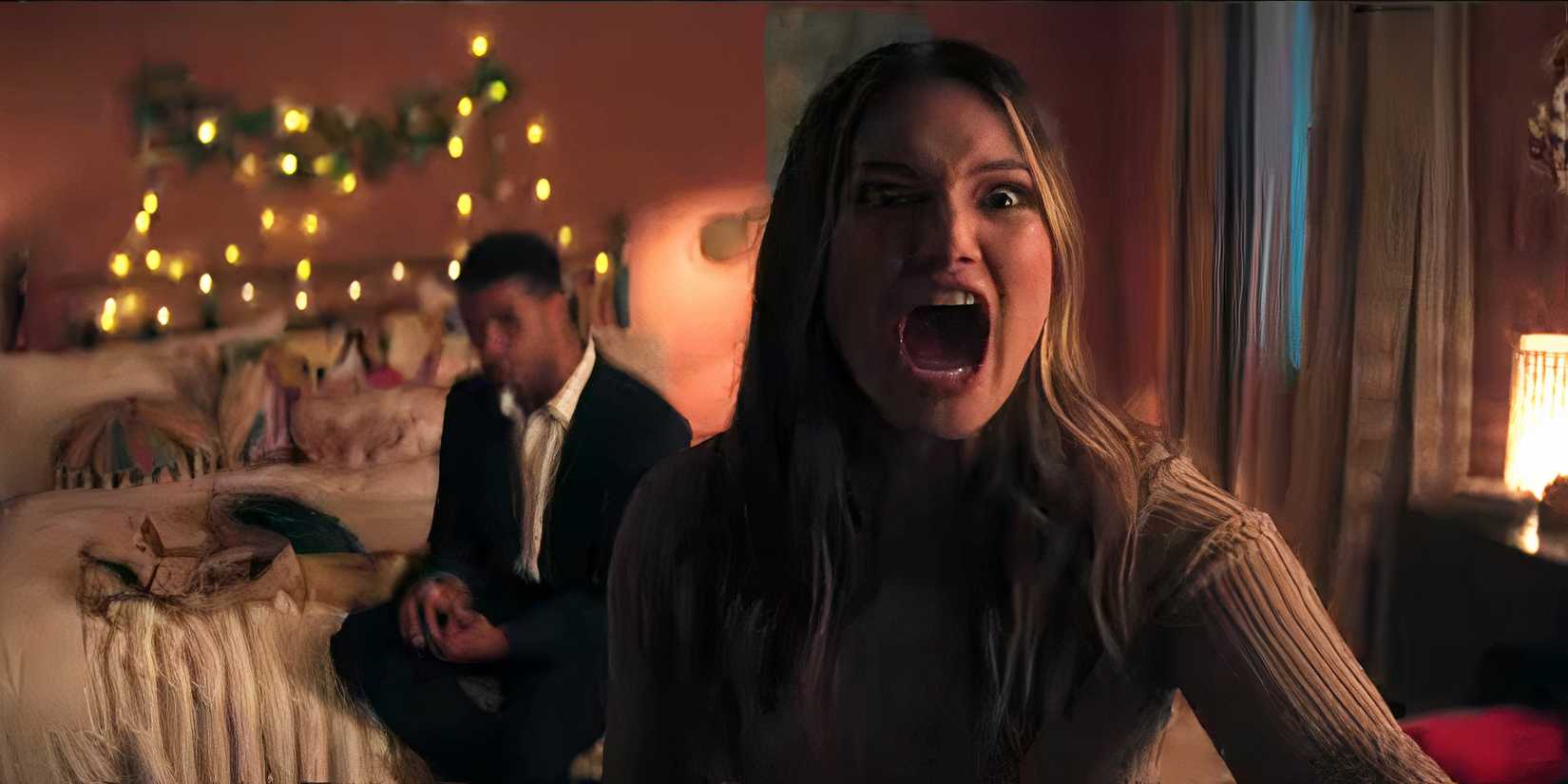 Olivia Holt screaming with Mason Gooding behind her in Heart Eyes