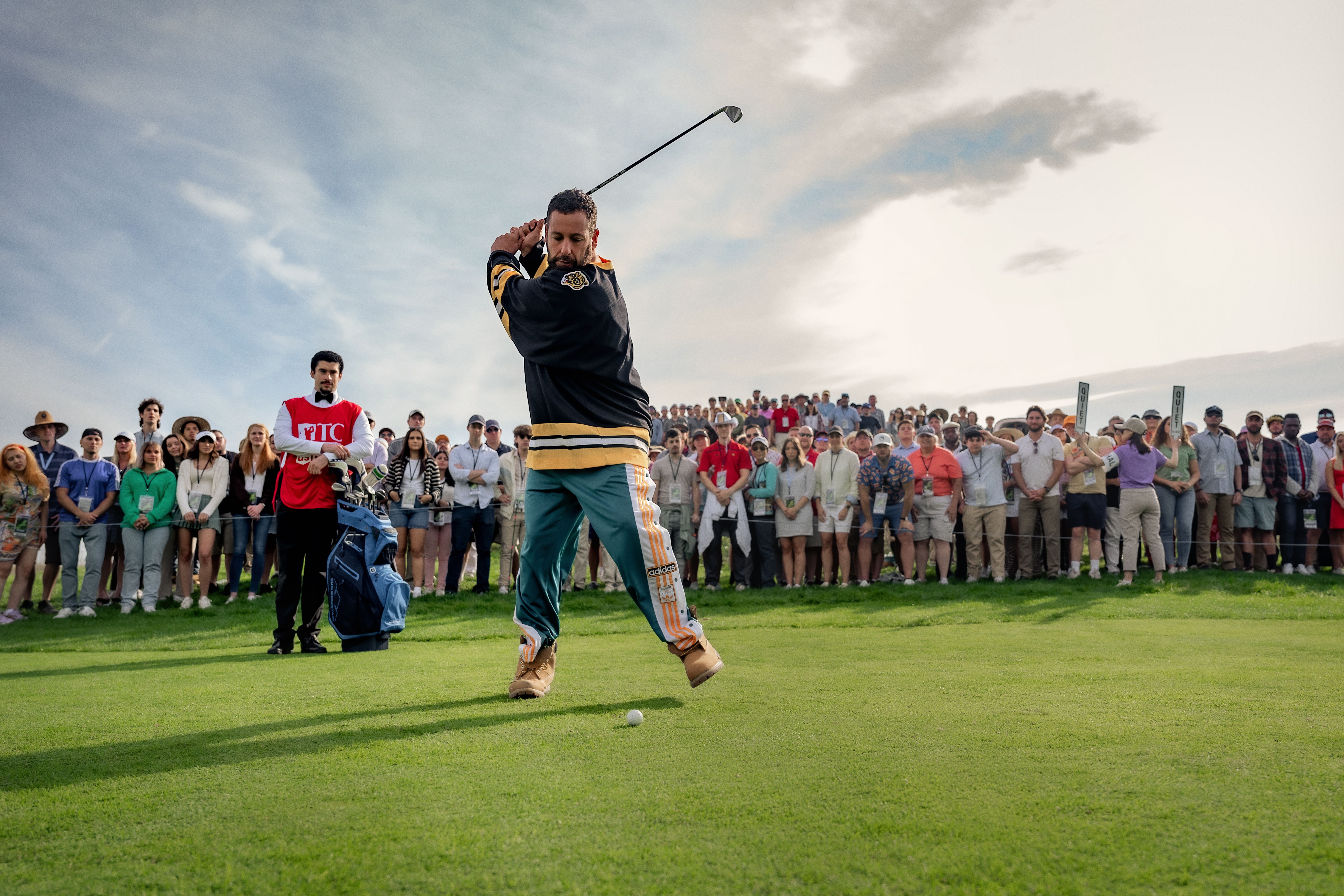 Happy Gilmore 2 image with Adam Sandler swinging golf club and Bad Bunny in background