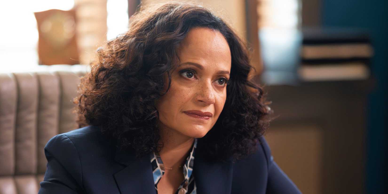 Selena (Judy Reyes) at her desk in High Potential. 