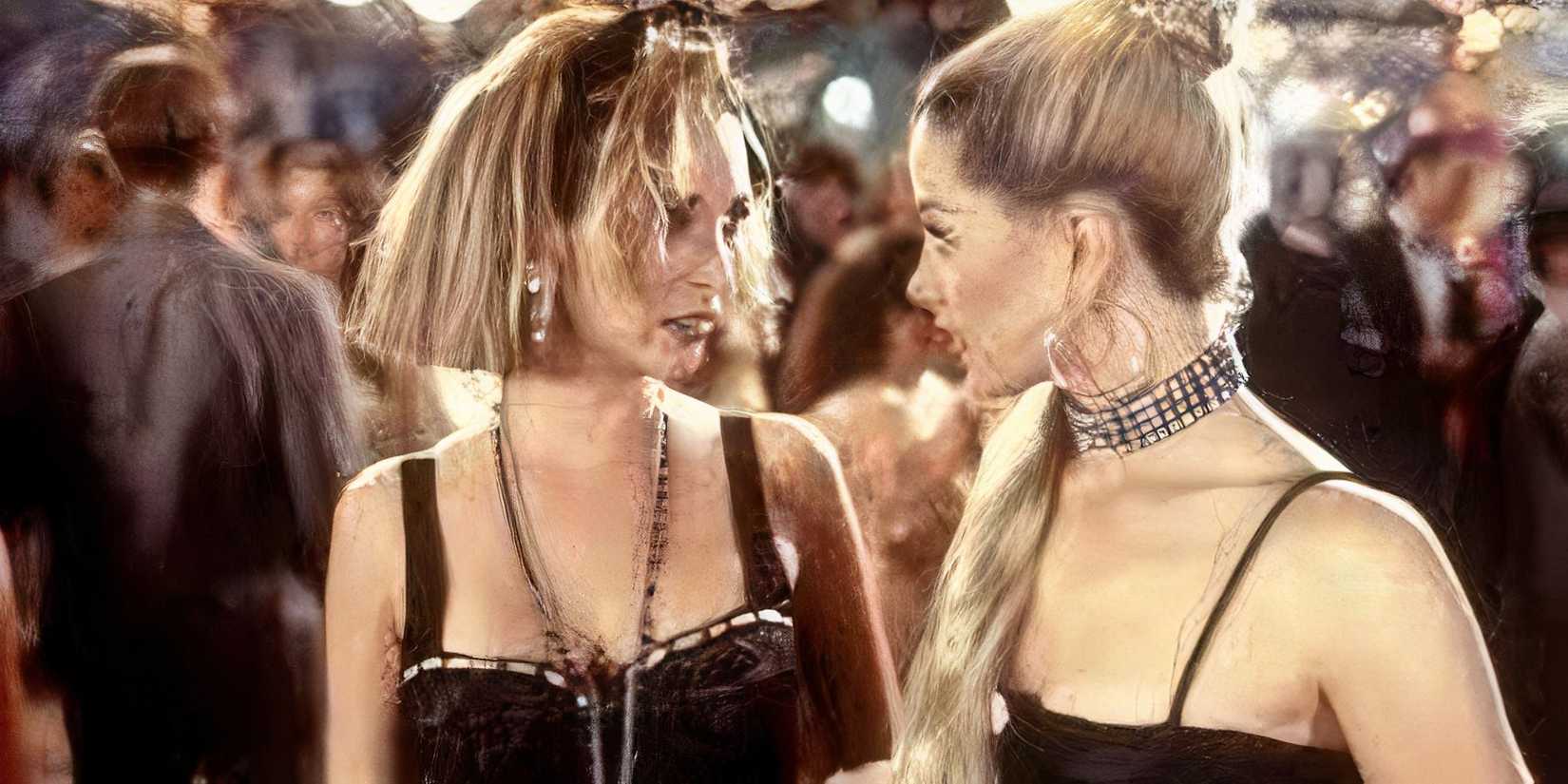 Lisa Kudrow and Mira Sorvino in Romy and Michele's High School Reunion wearing black tops and silver hoops and necklaces