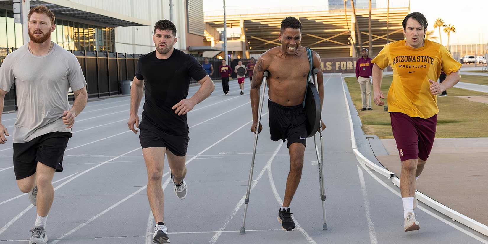 Jharrel Jerome as Anthony Robles on a track using crutches in Unstoppable