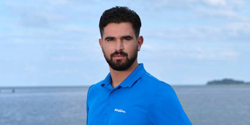 Johnny Arvanitis Below Deck Down Under Season 3 promo shot of him in blue shirt