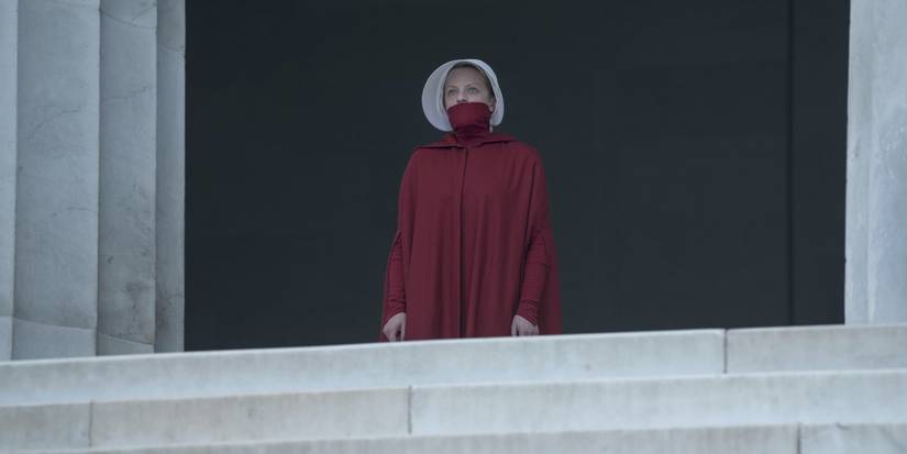 June standing in silence with her mouth covered in The Handmaid's Tale 'Household' episode