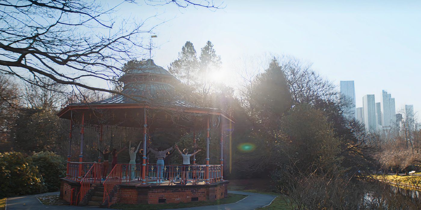 Kat and her friends do yoga on a bandstand in Missing You