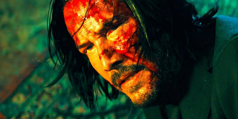 Keanu Reeves bloodied up as John at the end up John Wick 3