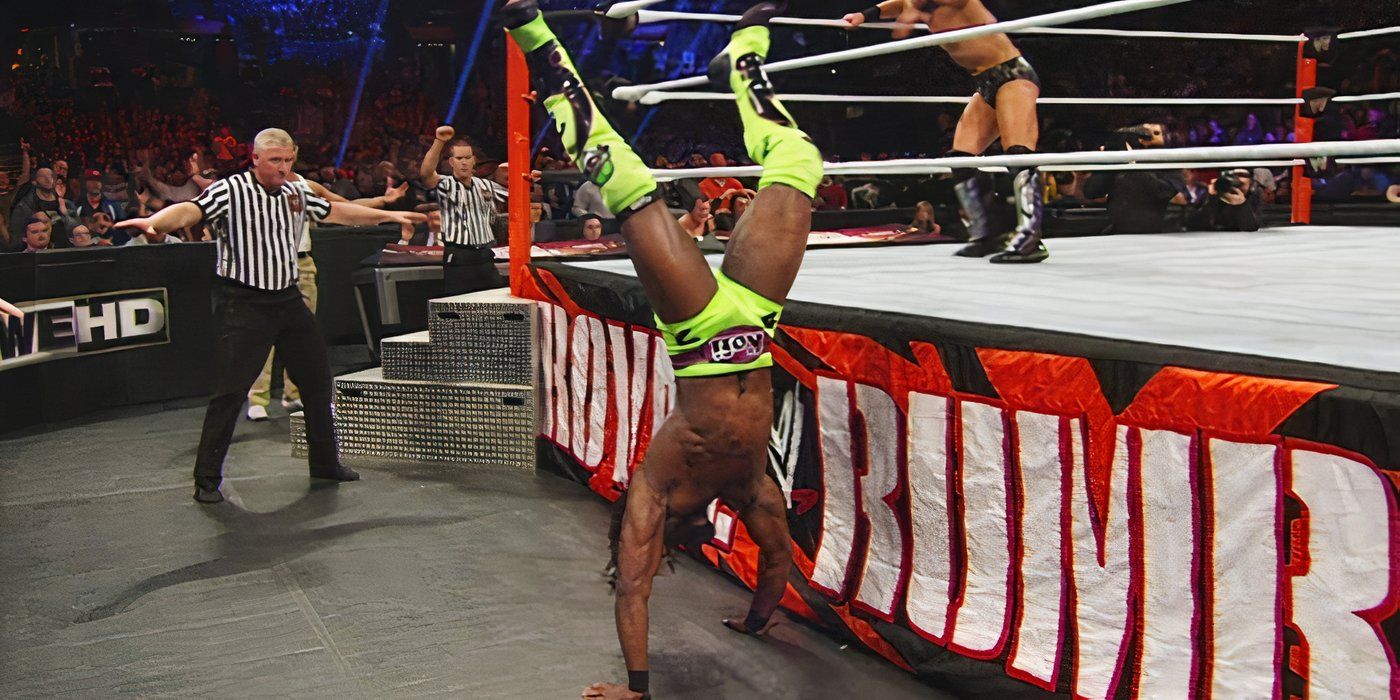 Kofi Kingston making a pin outside the ring in Royal Rumble