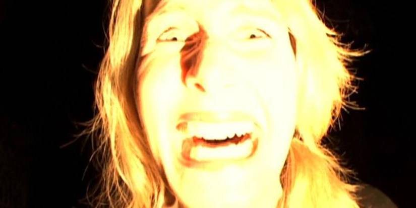 laura dern smiling in desperation in Inland Empire