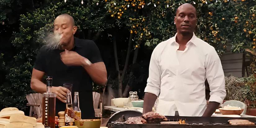 Ludacris as Tej spitting his drink while laughing next to Tyrese Gibson looking sad as Roman Pearce in Fast & Furious 6