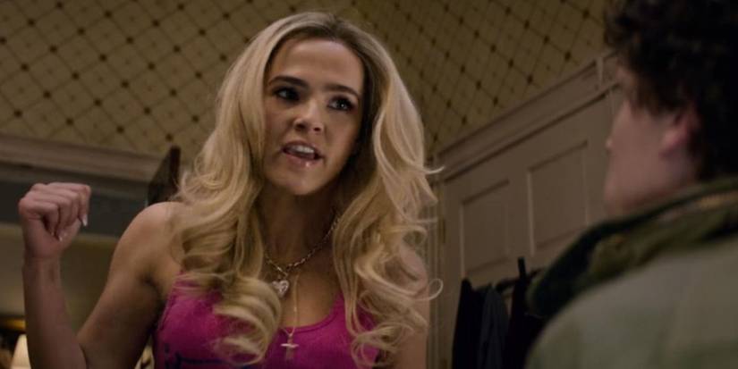 Madison (Zoey Deutch) raising a fist in Zombieland Double Tap.