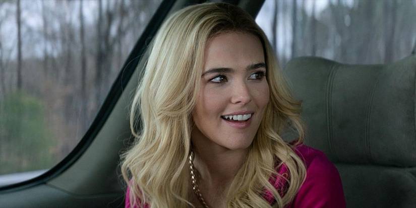 Madison (Zoey Deutch) smiling in the car in Zombieland Double Tap.