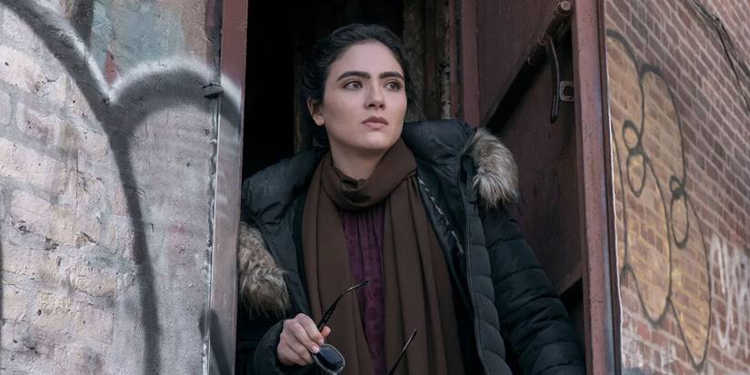 Arienne Mandi as Noor taking off her sunglasses in The Night Agent