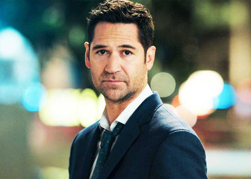 Manuel Garcia-Rulfo in The Lincoln Lawyer season 3, episode 10, standing in the street