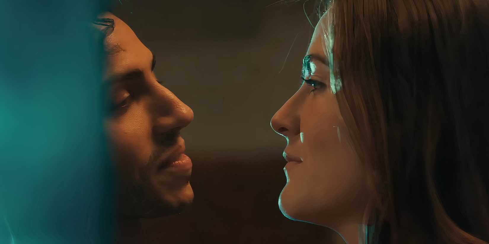 Mena Massoud's Adam and Isabelle Fuhrman's Charlotte looking sweetly at each other with their faces close in Wish You Were Here