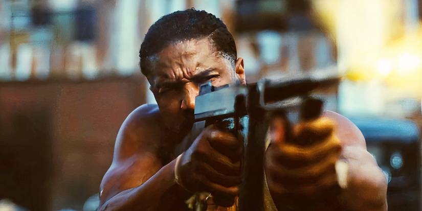 Michael B Jordan firing a Tommy gun in Sinners