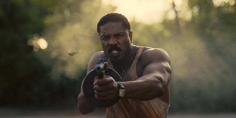 Michael B Jordan firing a Tommy gun in Sinners