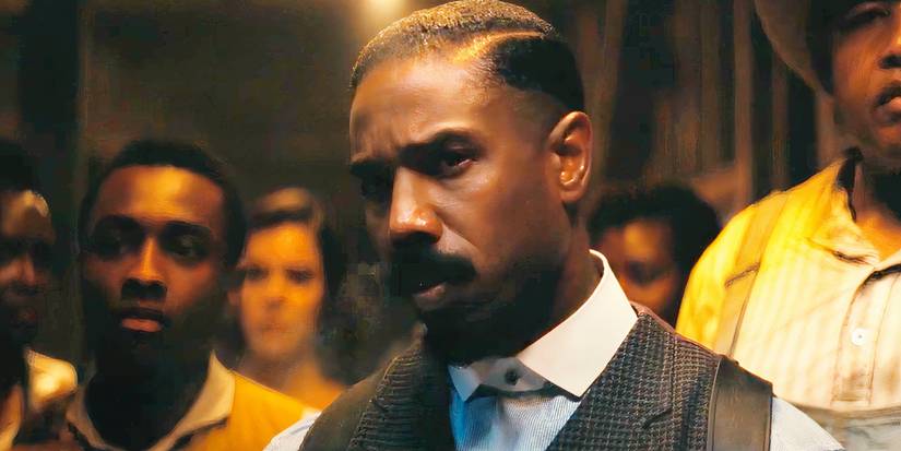 Michael B Jordan blowing smoke out of his nose in Sinners