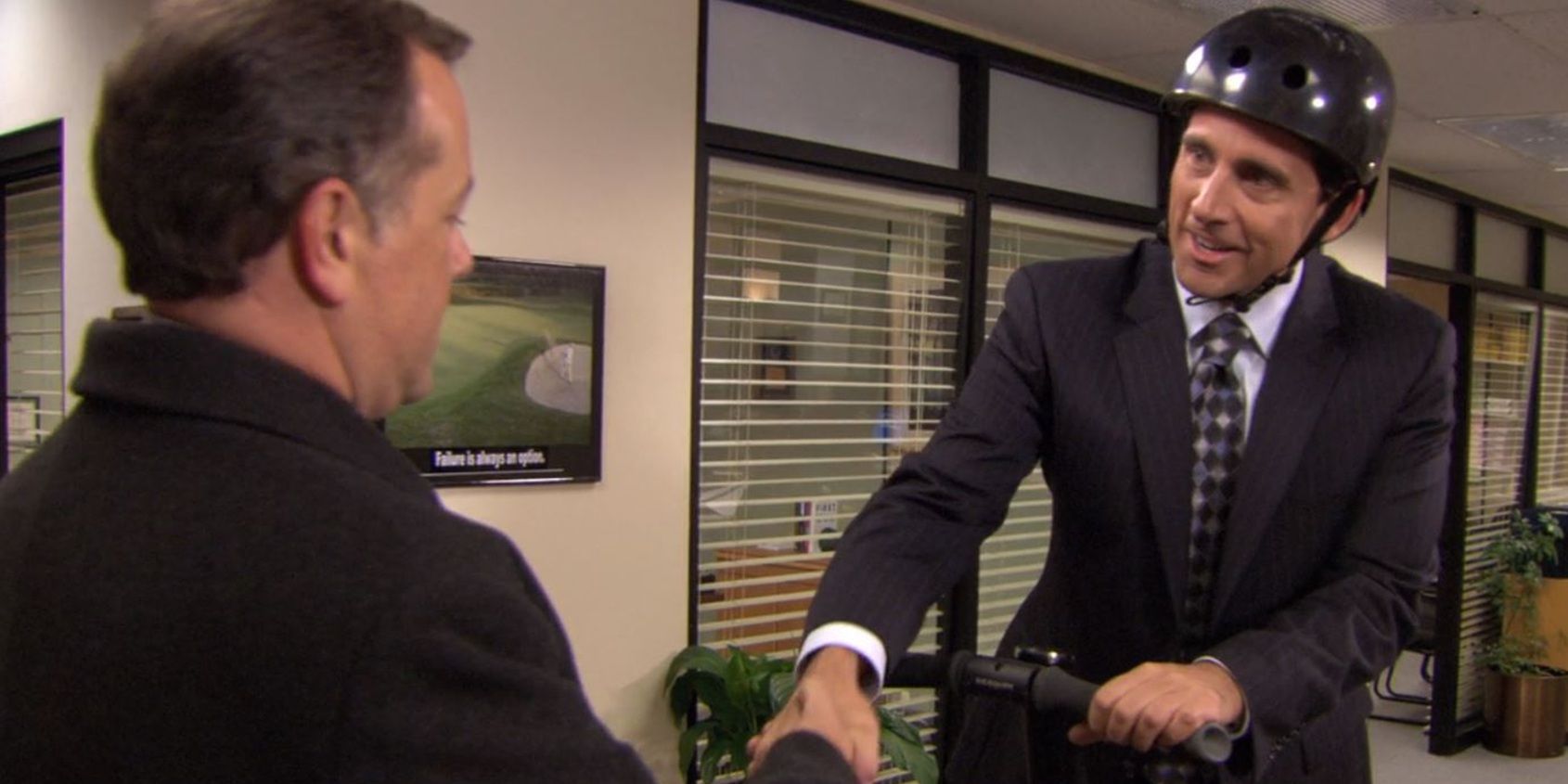 Michael greets the banker in the office