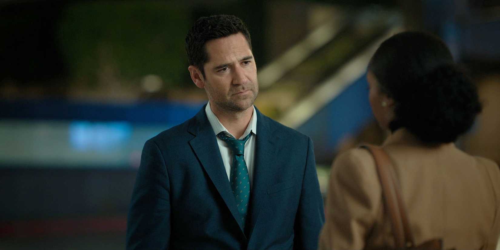 Mickey talking to Andy in The Lincoln Lawyer season 3, episode 10, and looking sad