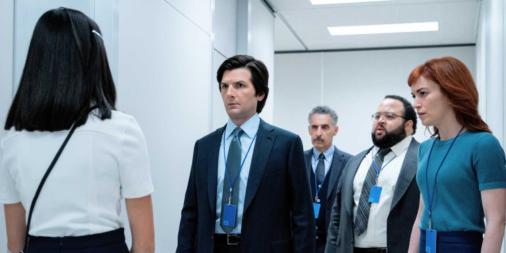 Miss Huang speaking to Mark Irving Dylan and Helly in the hallway in Severance season 2