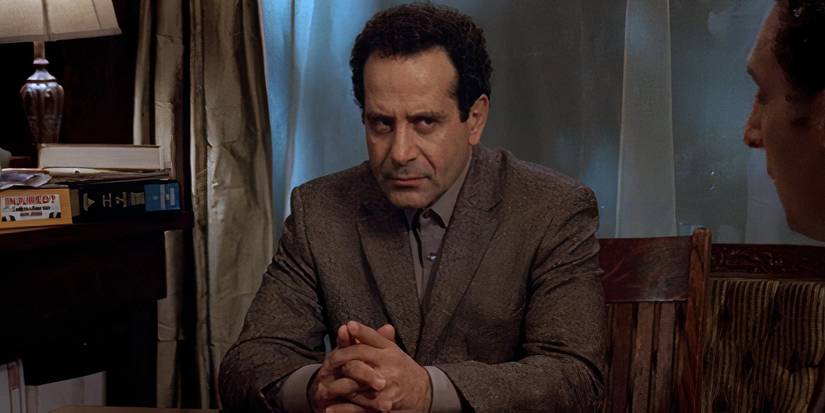 Monk sitting at the table in Mr Monk Goes Home Again