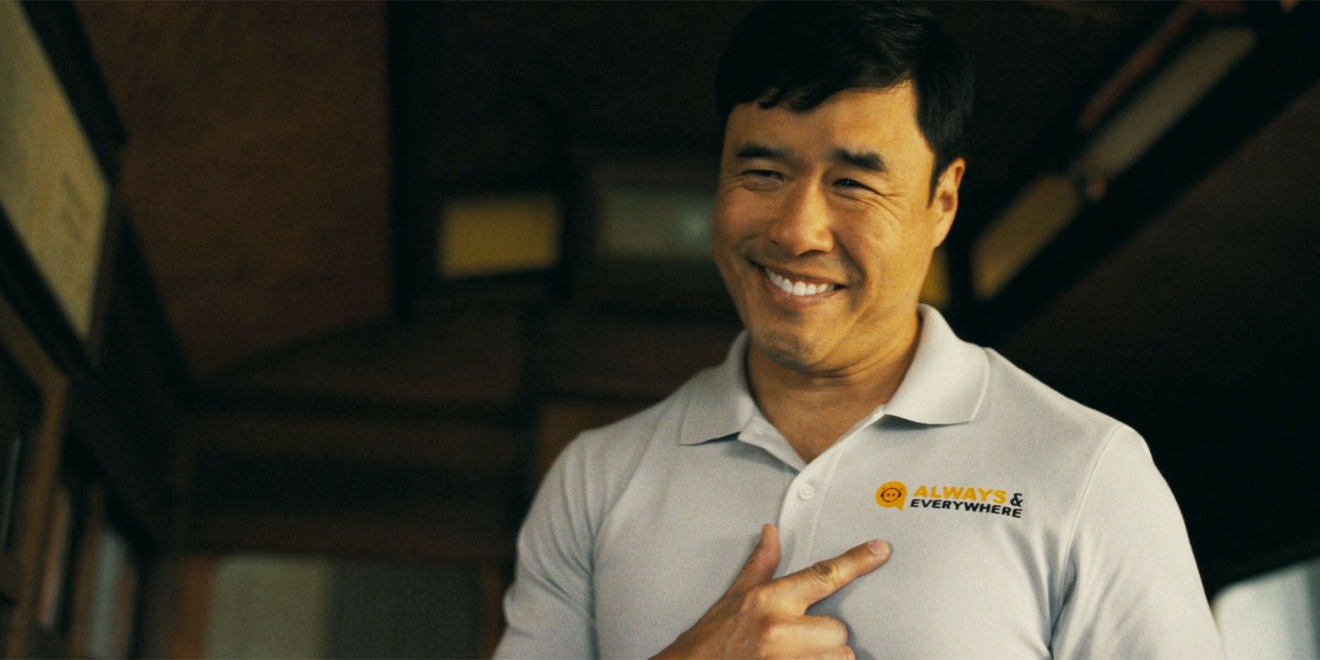 Moriarty (Randall Park) in Watson season 1, episode 1, smiling menacingly and pointing