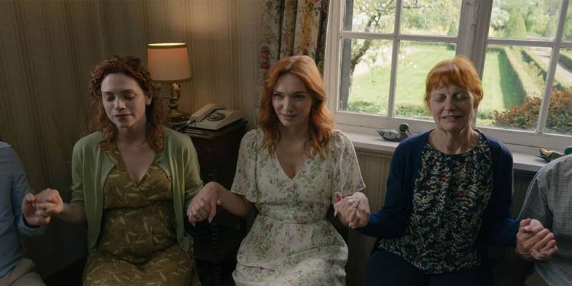 Evie, Rachel and their parents praying in The Couple Next Door