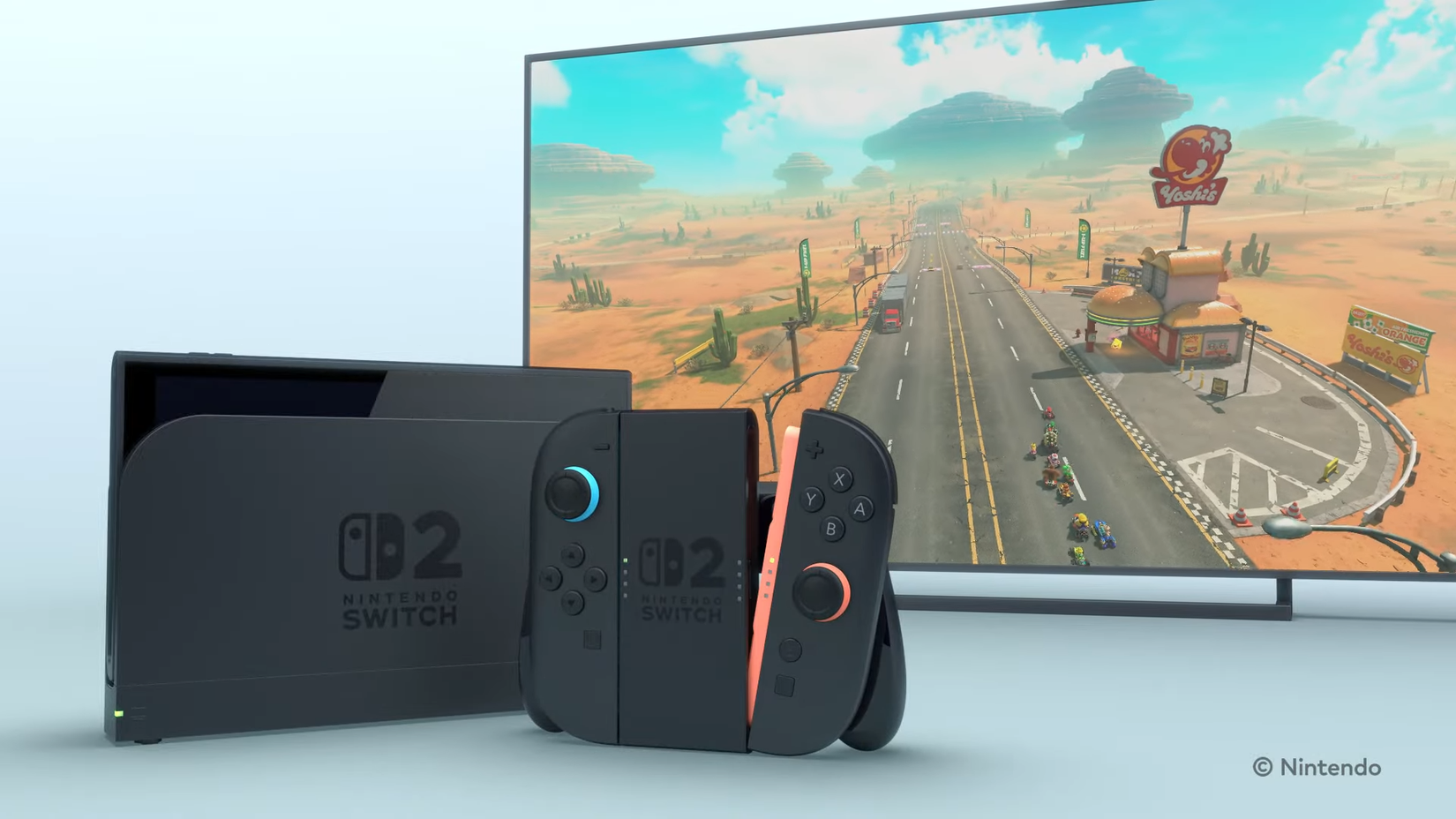 A Switch 2 and it's Joy-Cons attached to a controller peripheral, with a TV screen showing a new Mario Kart game in the background.