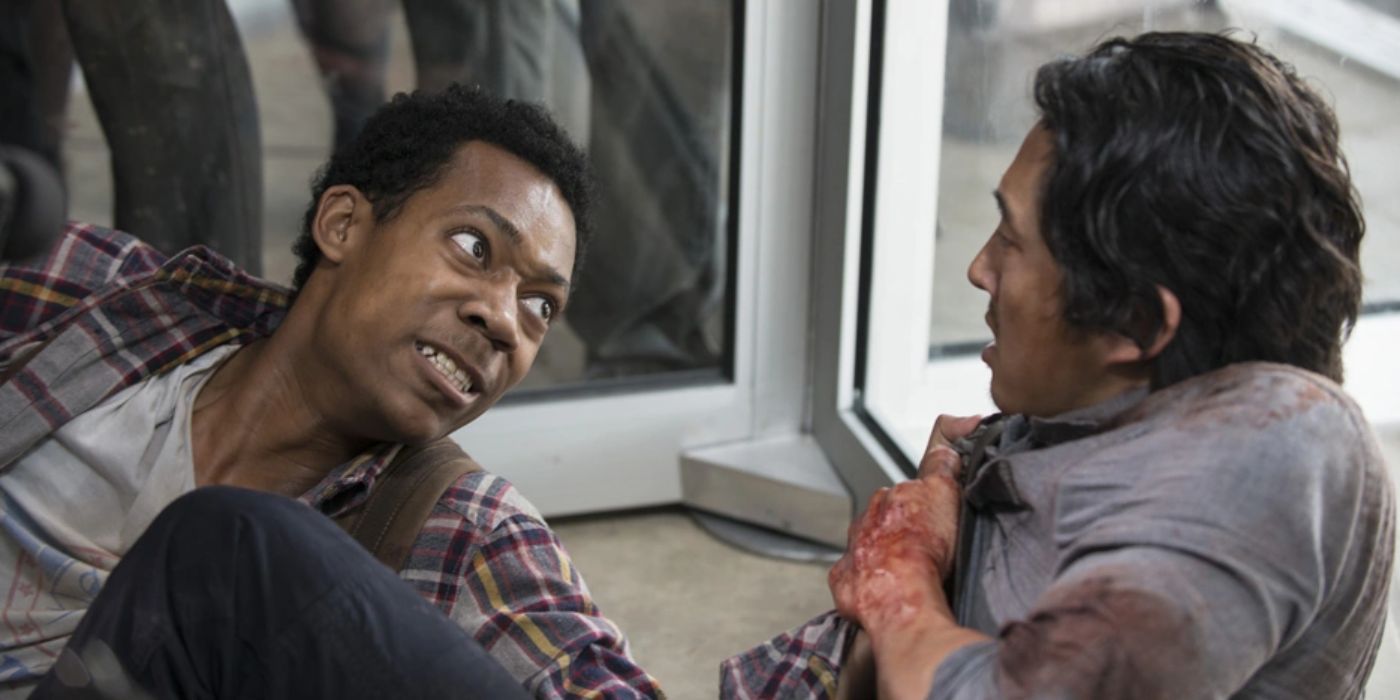 Noah (Tyler James Williams) grabbing Glenn (Steven Yeun) by the collar in The Walking Dead.