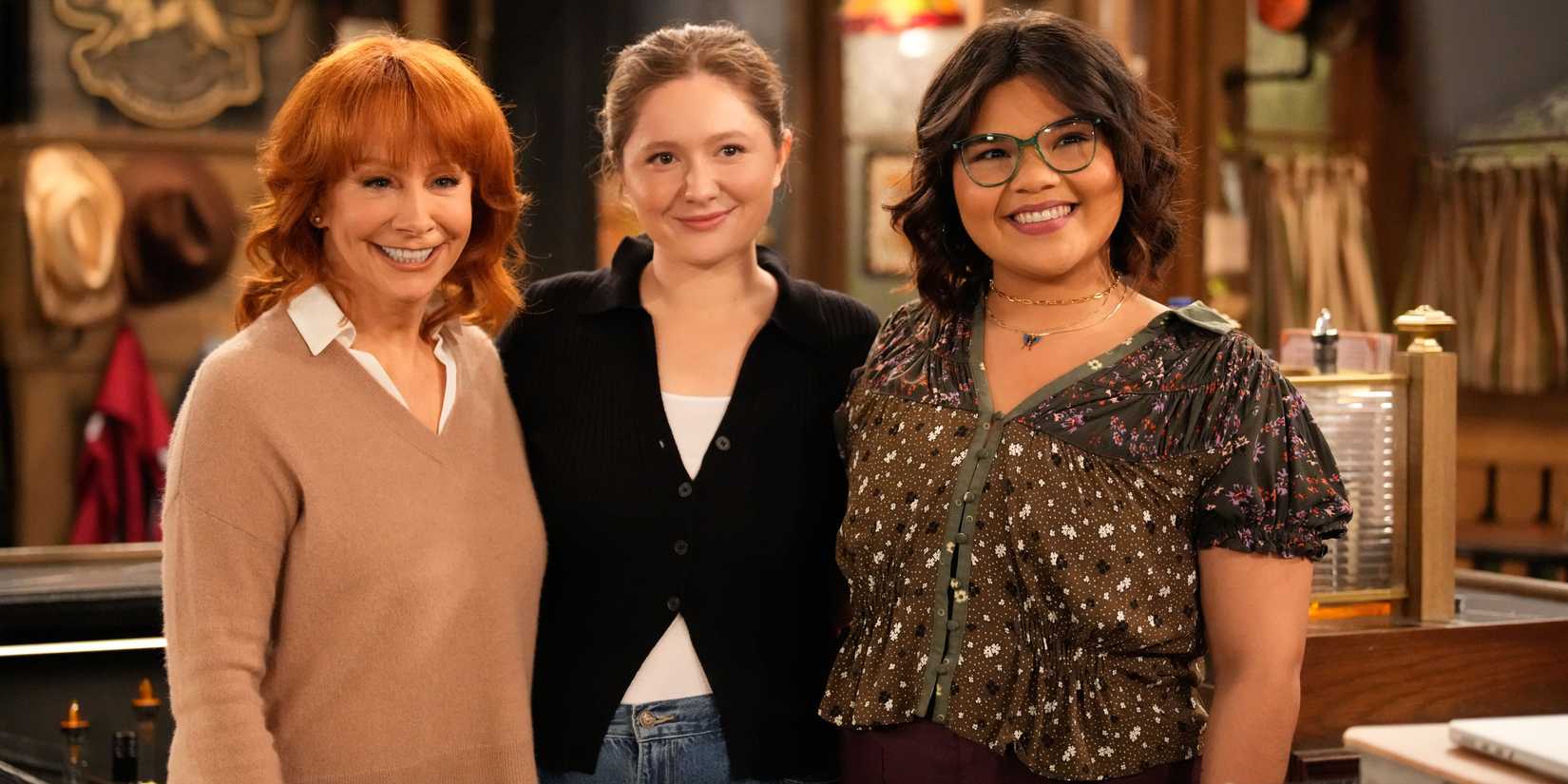 Bobbie, Gracie, and Isabelle posing for a photo in Happy's Place season 1, episode 10