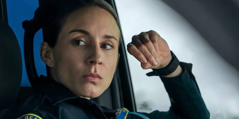 Traci (Troian Bellisario) sitting in a cop car in On Call