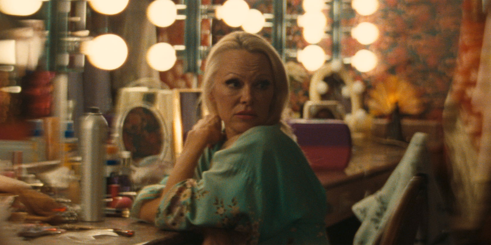 Pamela Anderson sitting at a vanity in The Last Showgirl