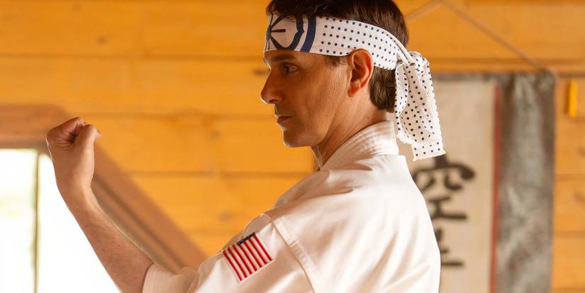 Ralph Macchio as Daniel LaRusso making a karate pose in Cobra Kai season 6 part 3