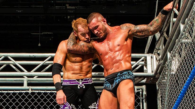 Randy Orton gives Christian an RKO from the top of the cage