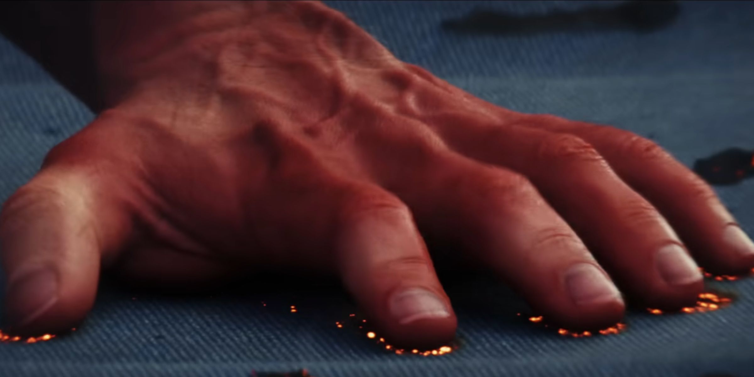 Red Hulk hand burning fabric as seen in the Captain America_ Brave New World trailer