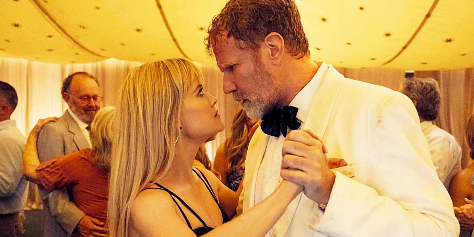 Reese Witherspoon and Will Ferrell dancing while glaring at each other and bringing their faces very close in You're Cordially Invited